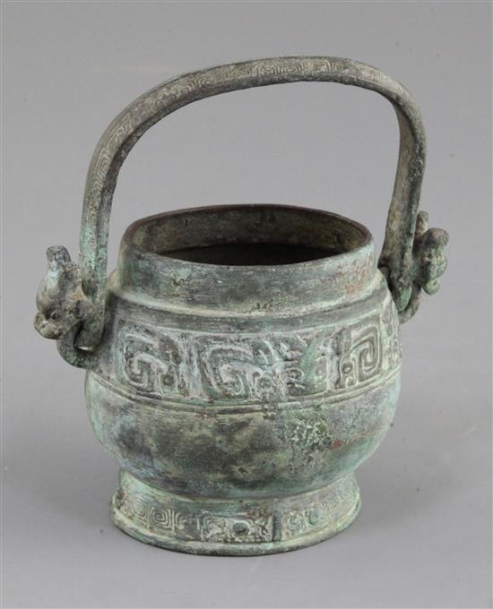 A small Chinese archaic bronze ritual wine vessel, You, Western Zhou dynasty, 10th century B.C., 13cm high, lacking cover